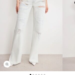 Good American Distressed Cream Flare Jeans